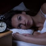 Woman can't sleep because of insomnia.